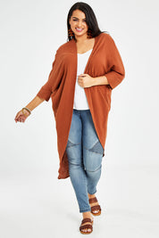 Model Sasha-Lee wearing size 16 of the Falling For You Cotton Cardi in colour Cinnamon, from the front, showing the whole outfit