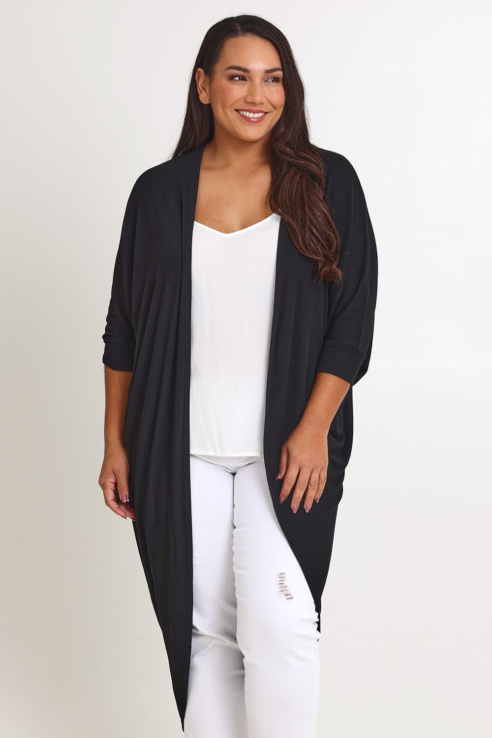 Model Ashleigh wearing size 16 of the Falling For You Cardi in colour Black (Black), from the front, cropped image