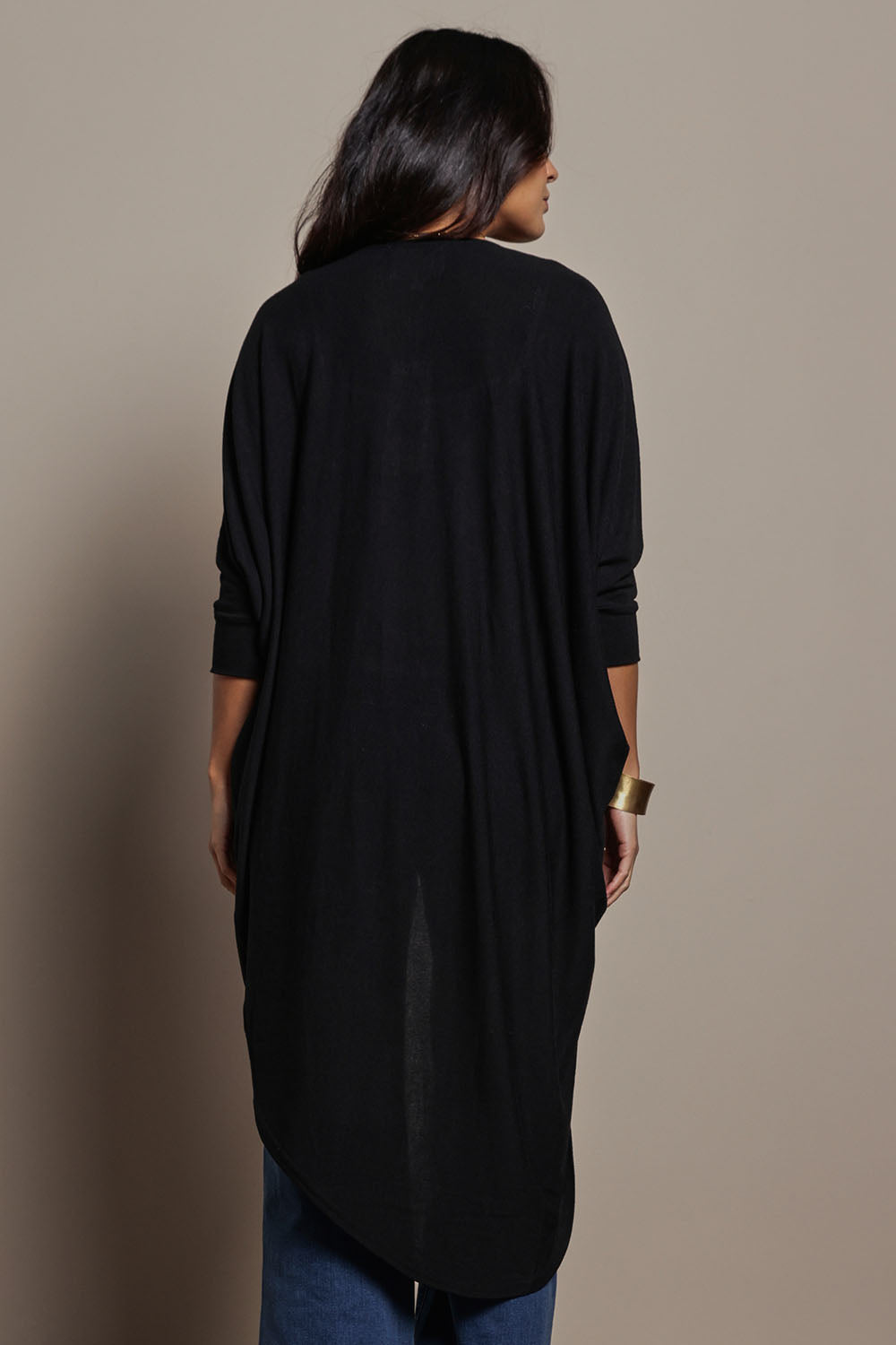 Model Tahnee wearing size 10 of the Falling For You Cardi in colour Black (Black), from the back