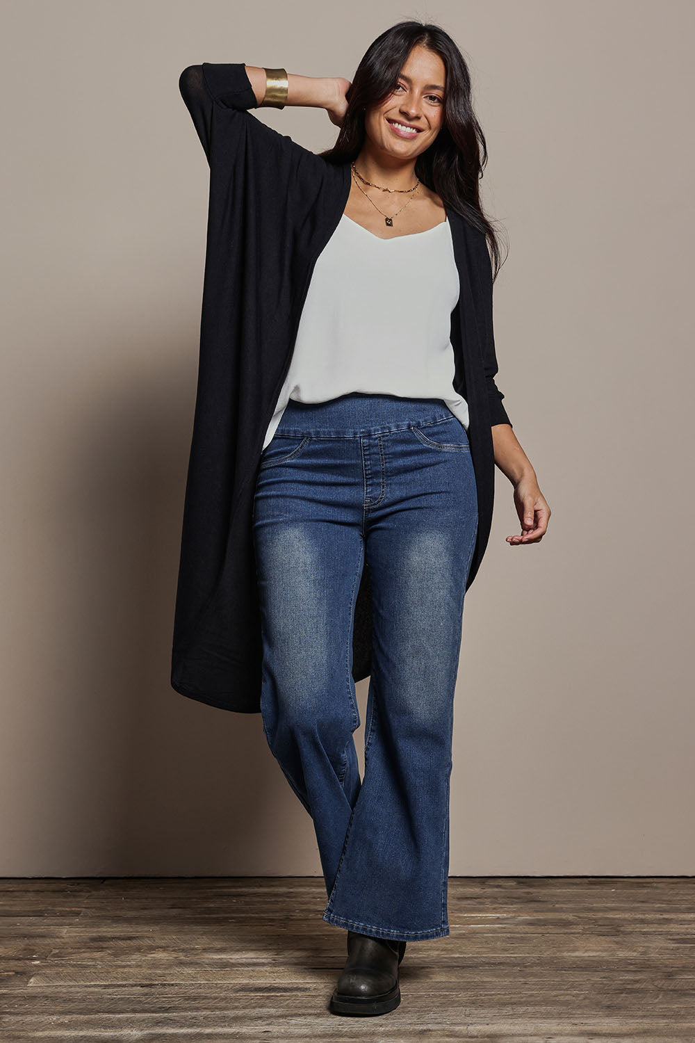 Model Tahnee wearing size 10 of the Falling For You Cardi in colour Black (Black), from the front, showing the whole outfit