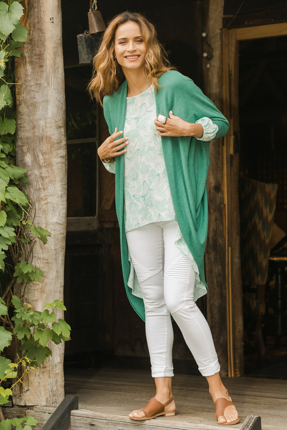 Model Ilona wearing size 10 of the Falling For You Cardi in colour Myrtle (Green), from the front, showing the whole outfit