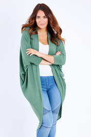 Model Laura wearing size 14 of the Falling For You Cardi in colour Myrtle (Green), from the front, cropped image
