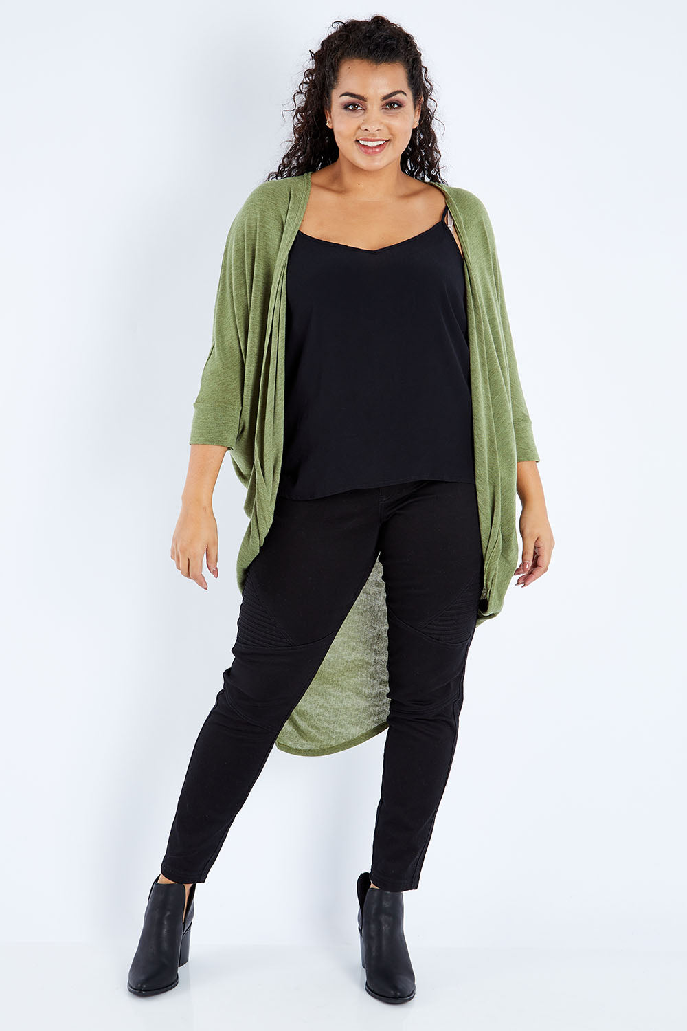 Model Sasha-Lee wearing size 16 of the Falling For You Cardi in colour Olive (Green), from the front, showing the whole outfit