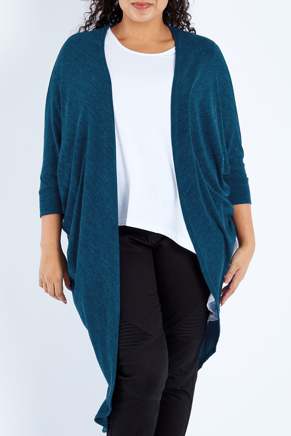 Model Sasha-Lee wearing size 16 of the Falling For You Cardi in colour Petrol (Blue), from the front, cropped image