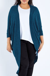 Model Sasha-Lee wearing size 16 of the Falling For You Cardi in colour Petrol (Blue), from the front, cropped image