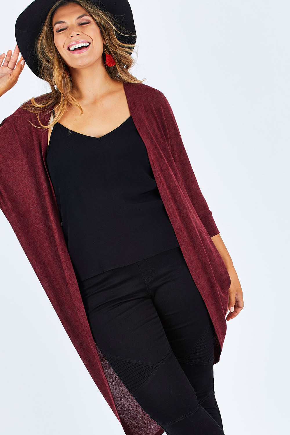 Model Palatina wearing size 14 of the Falling For You Cardi in colour Port (Purple), from the front, cropped image