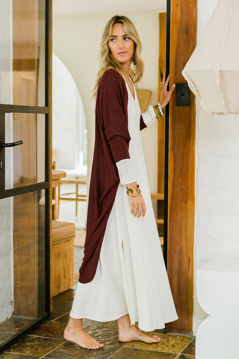 Model Tegan wearing size 10 of the Falling For You Cardi in colour Port (Purple), from the front, showing the whole outfit
