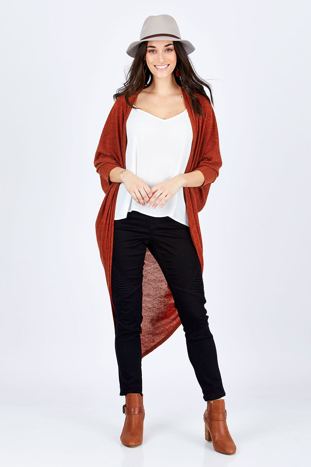 Model Georgia wearing size 10 of the Falling For You Cardi in colour Rust, from the front, showing the whole outfit