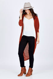 Model Georgia wearing size 10 of the Falling For You Cardi in colour Rust, from the front, showing the whole outfit