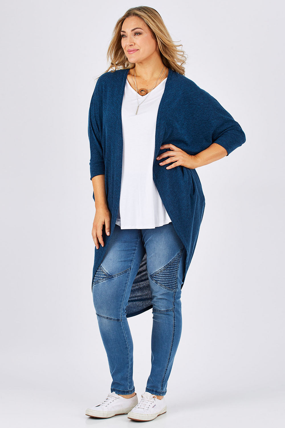 Model Ljubenka wearing size 18 of the Falling For You Cardi in colour Teal (Blue), from the front, showing the whole outfit