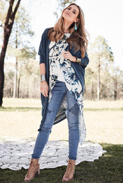 Model Marnee wearing size 10 of the Falling For You Cardi in colour Teal (Blue), from the front, showing the whole outfit