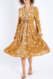 Model Lala wearing size 10 of the Dancing With Birds Midi Dress in colour Clay, from the front, cropped image