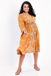 Model Sasha-Lee wearing size 16 of the Dancing With Birds Midi Dress in colour Clay, from the front, showing the whole outfit