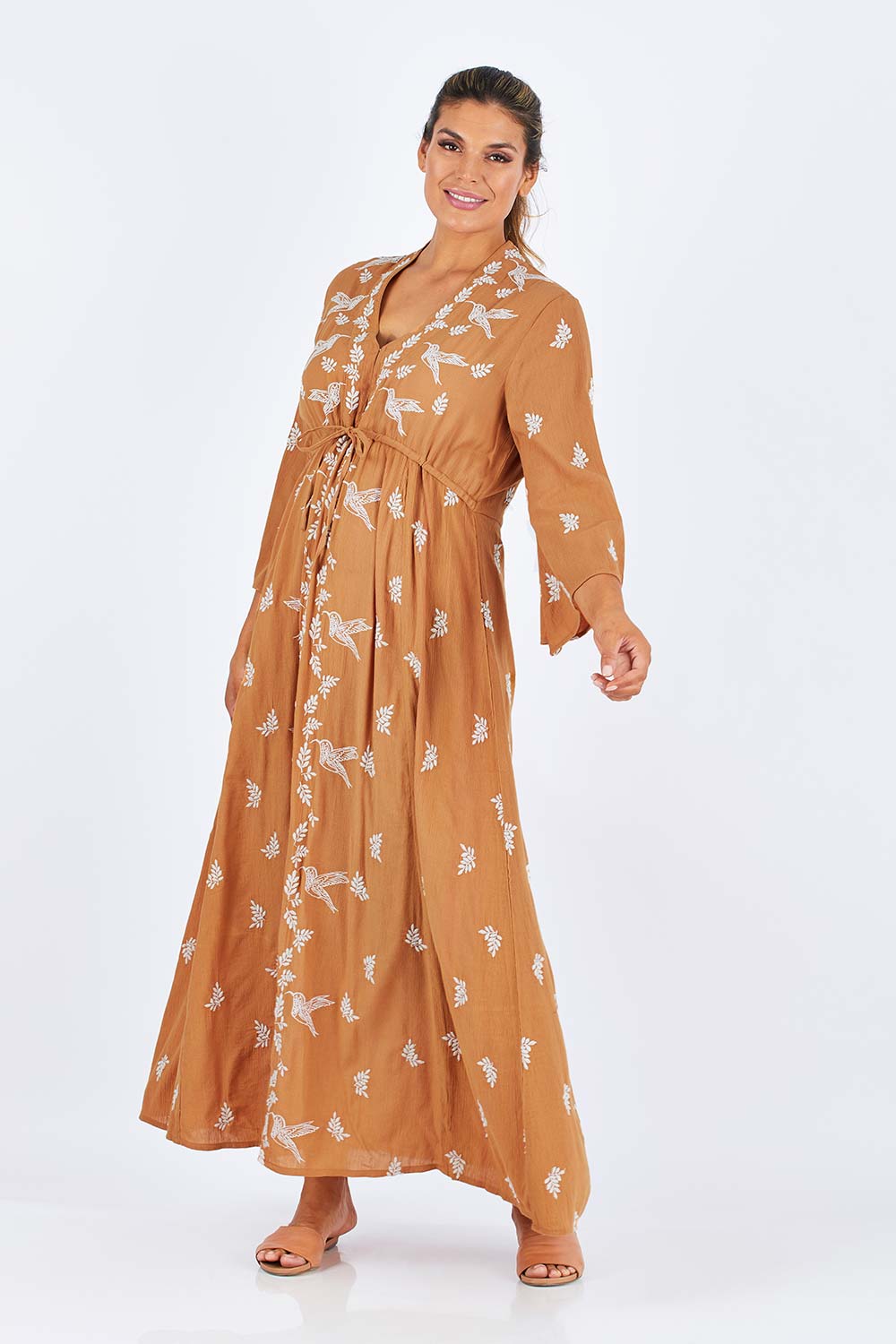 Model Palatina wearing size 14 of the Dancing With Birds Dress in colour Golden, from the front, showing the whole outfit