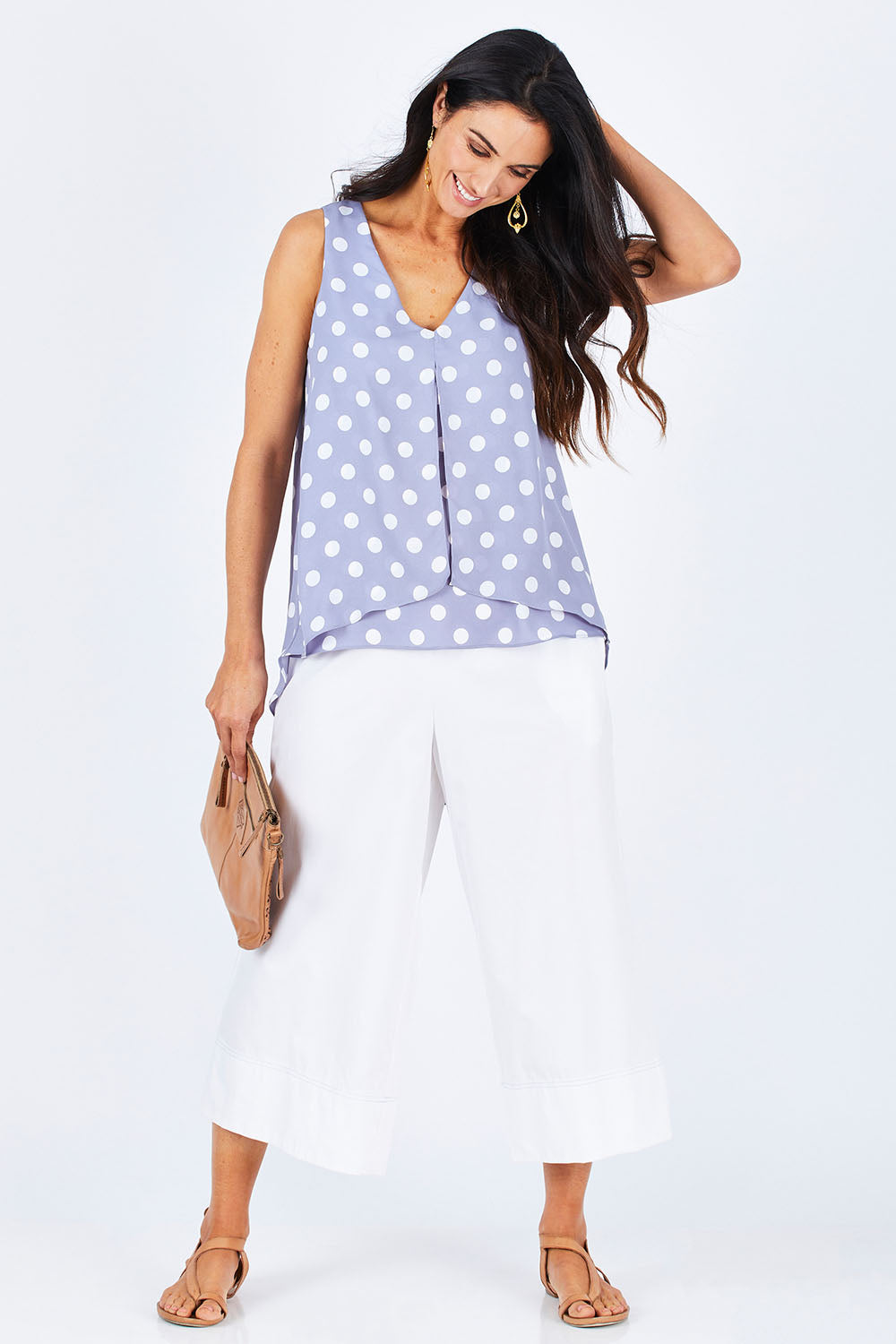 Model Gemma wearing size 10 of the Sugar Snaps Layer Tank in colour Dustyblue (Blue), from the front, showing the whole outfit