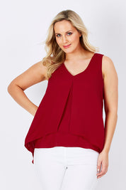 Model Jess wearing size 12 of the Sugar Snaps Layers Tank in colour Red (Red), from the front, cropped image