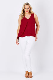 Model Jess wearing size 12 of the Sugar Snaps Layers Tank in colour Red (Red), from the front, showing the whole outfit