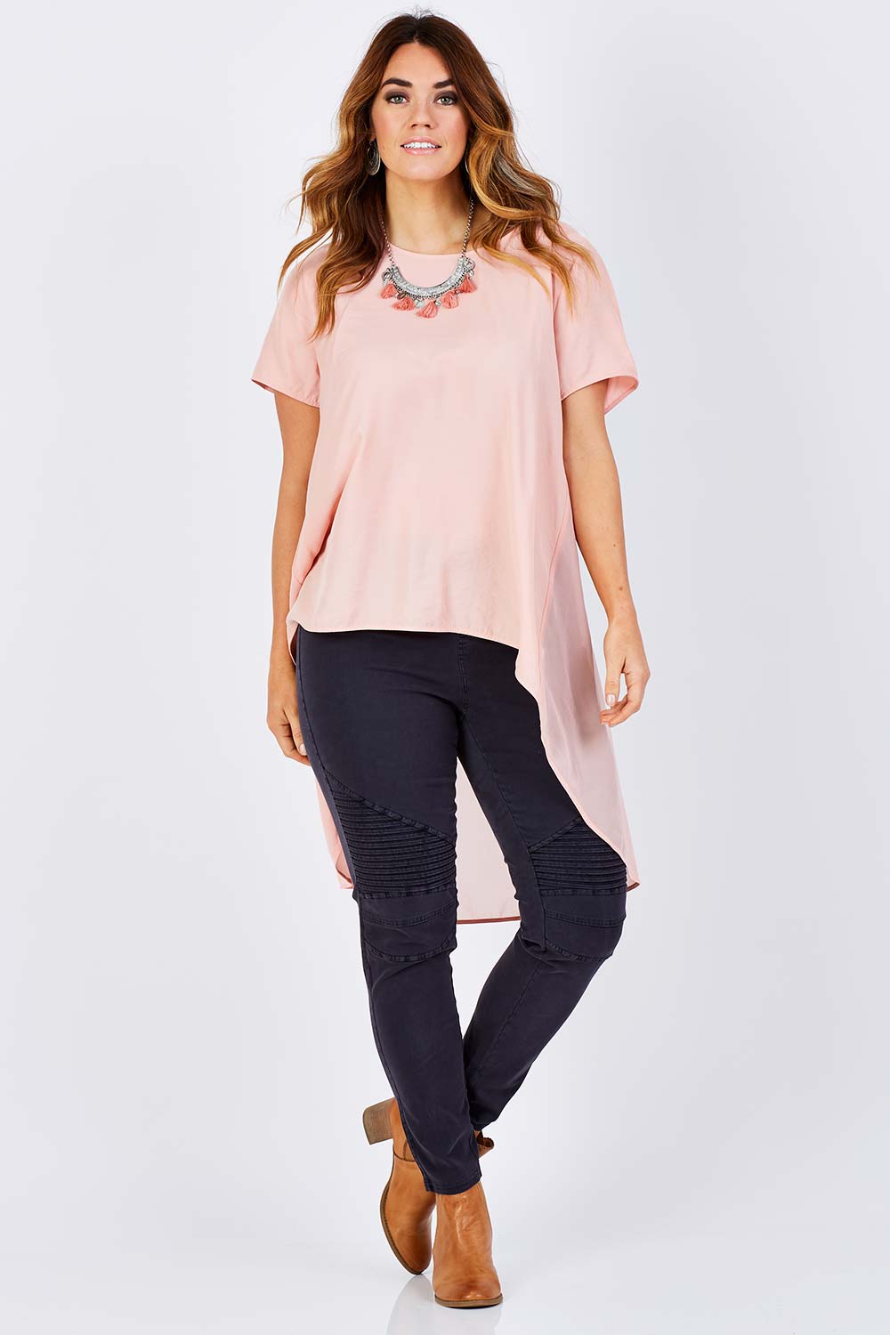 Model Laura wearing size 12 of the Wild Tribe Stitched Jeggings in colour Indigo (Blue), from the front, showing the whole outfit