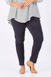 Model Mae wearing size 18 of the Wild Tribe Stitched Jeggings in colour Indigo (Blue), from the front, cropped image