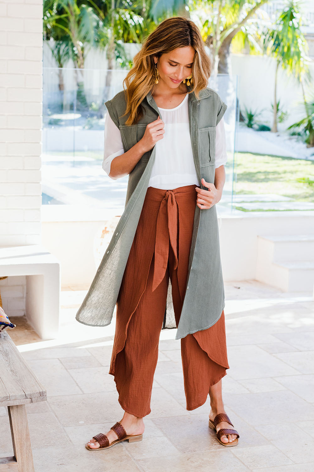 Model Ilona wearing size 10 of the Wrapped In You Cotton Pants in colour Cinnamon, from the front, showing the whole outfit