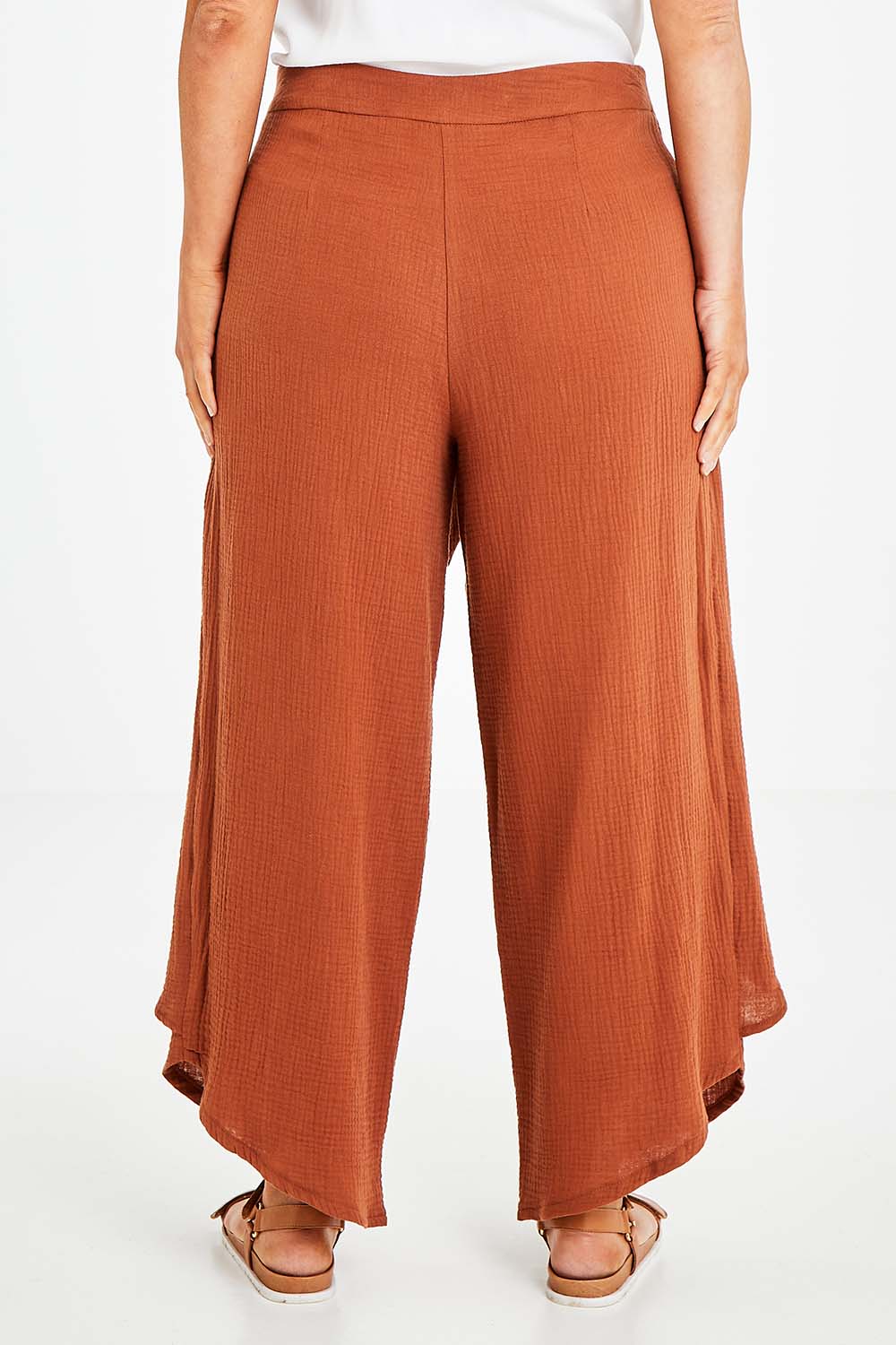 Model Laura wearing size 14 of the Wrapped In You Cotton Pants in colour Cinnamon, from the back