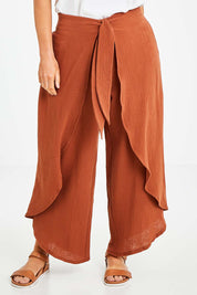 Model Laura wearing size 14 of the Wrapped In You Cotton Pants in colour Cinnamon, from the front, cropped image
