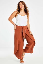 Model Laura wearing size 14 of the Wrapped In You Cotton Pants in colour Cinnamon, from the front, showing the whole outfit