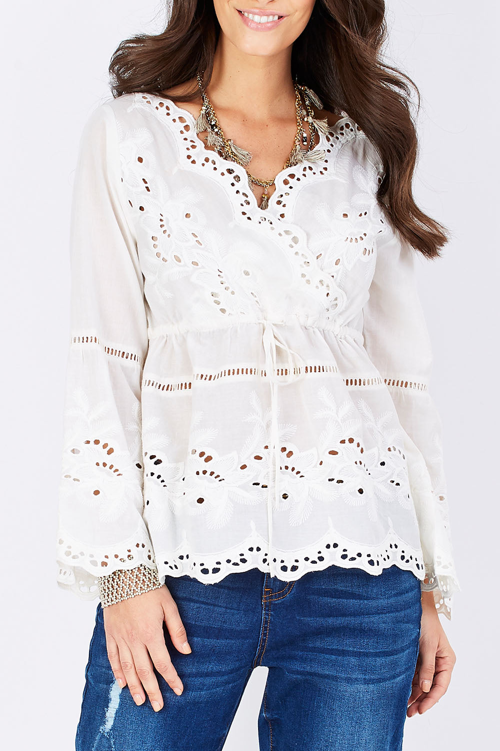 Model Georgia wearing size 10 of the New Romantics Tunic in colour White (White), from the front, cropped image