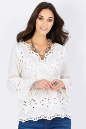 Model Georgia wearing size 10 of the New Romantics Tunic in colour White (White), from the front, cropped image