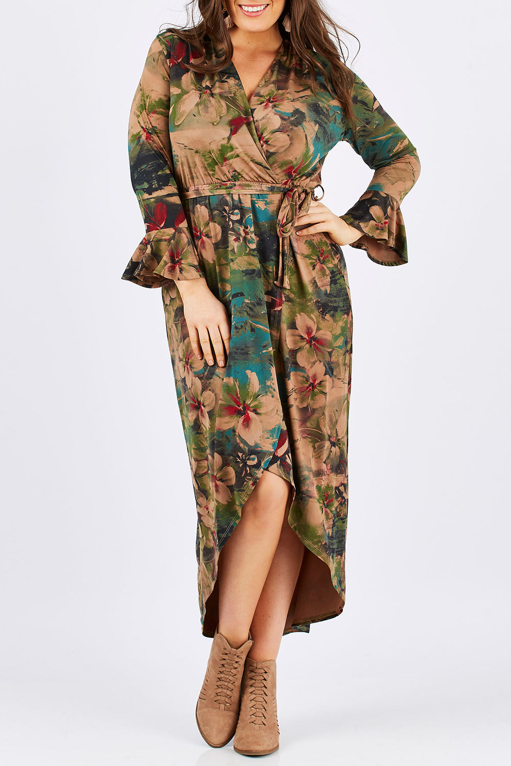 Model Tia wearing size 14 of the Cloud Dancer Dress in colour Rust, from the front, cropped image