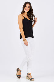 Model Georgia wearing size 10 of the Runaway Top in colour JetBlack (Black), from the front, showing the whole outfit