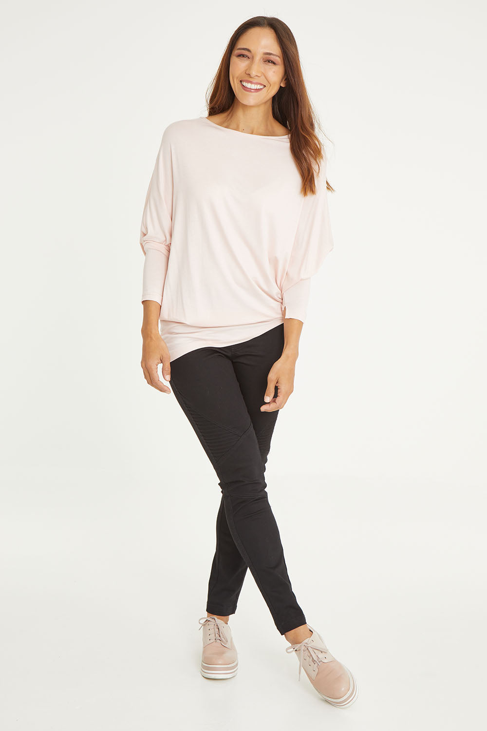 Model Cara wearing size 10 of the Wild Plains Stitched Jeggings in colour Black (Black), from the front, showing the whole outfit