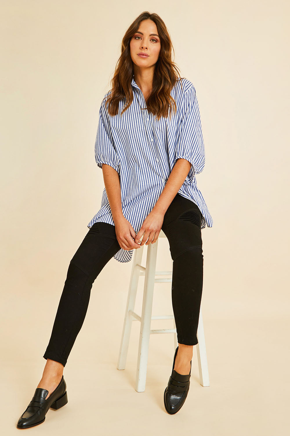 Model Madeline wearing size 10 of the Wild Plains Stitched Jeggings in colour Black (Black), from the front, showing the whole outfit