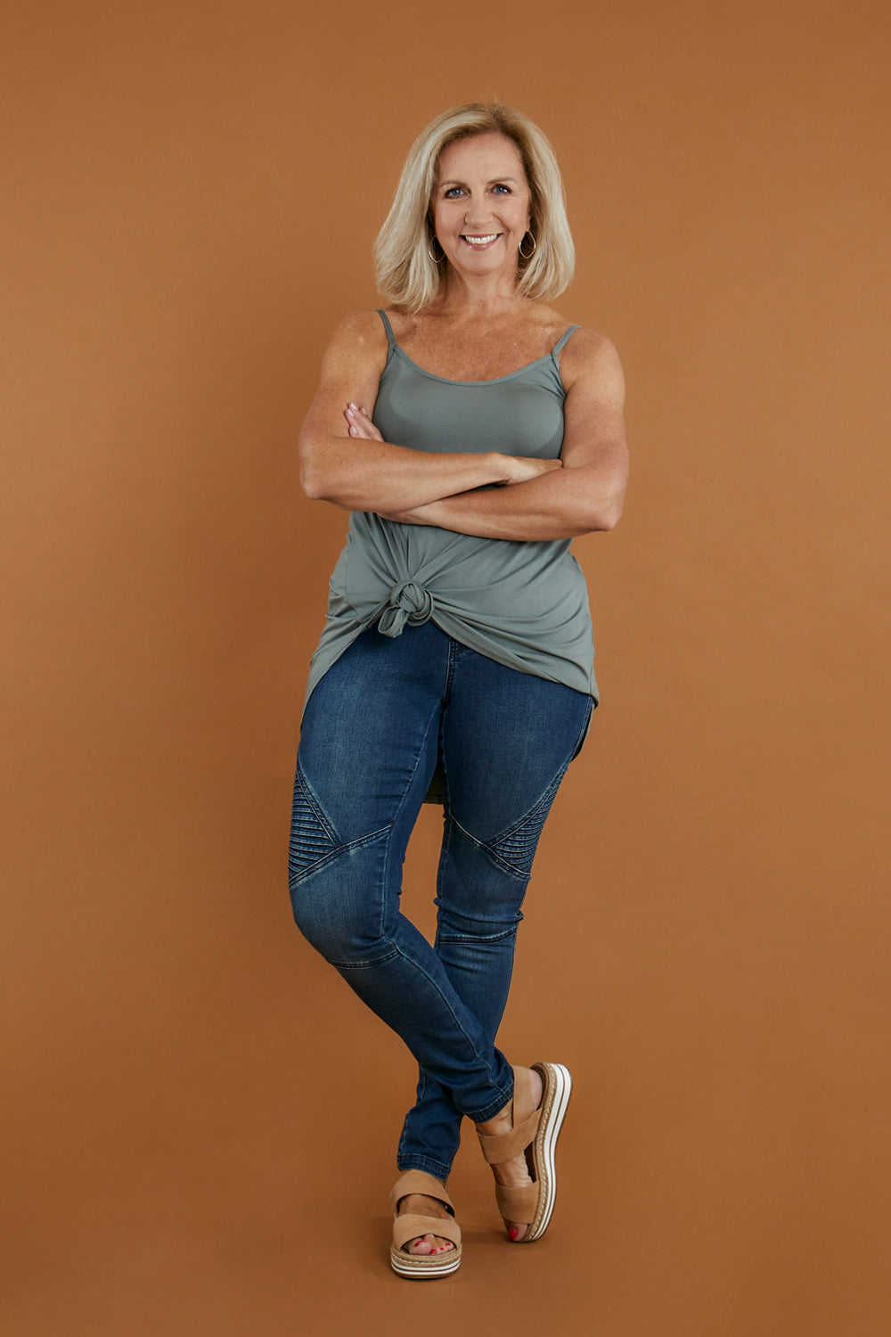 Model Sandy wearing size 10 of the Wild Plains Stitched Jeggings in colour Denim (Blue), from the front, showing the whole outfit