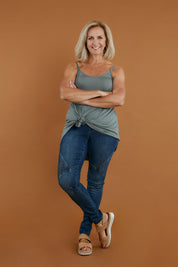 Model Sandy wearing size 10 of the Wild Plains Stitched Jeggings in colour Denim (Blue), from the front, showing the whole outfit
