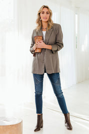 Model Tegan wearing size 10 of the Wild Plains Stitched Jeggings in colour Denim (Blue), from the front, showing the whole outfit