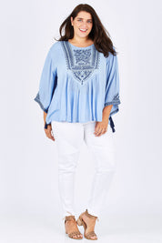 Model Mae wearing size 18 of the Wild Plains Stitched Jeggings in colour White (White), from the front, showing the whole outfit