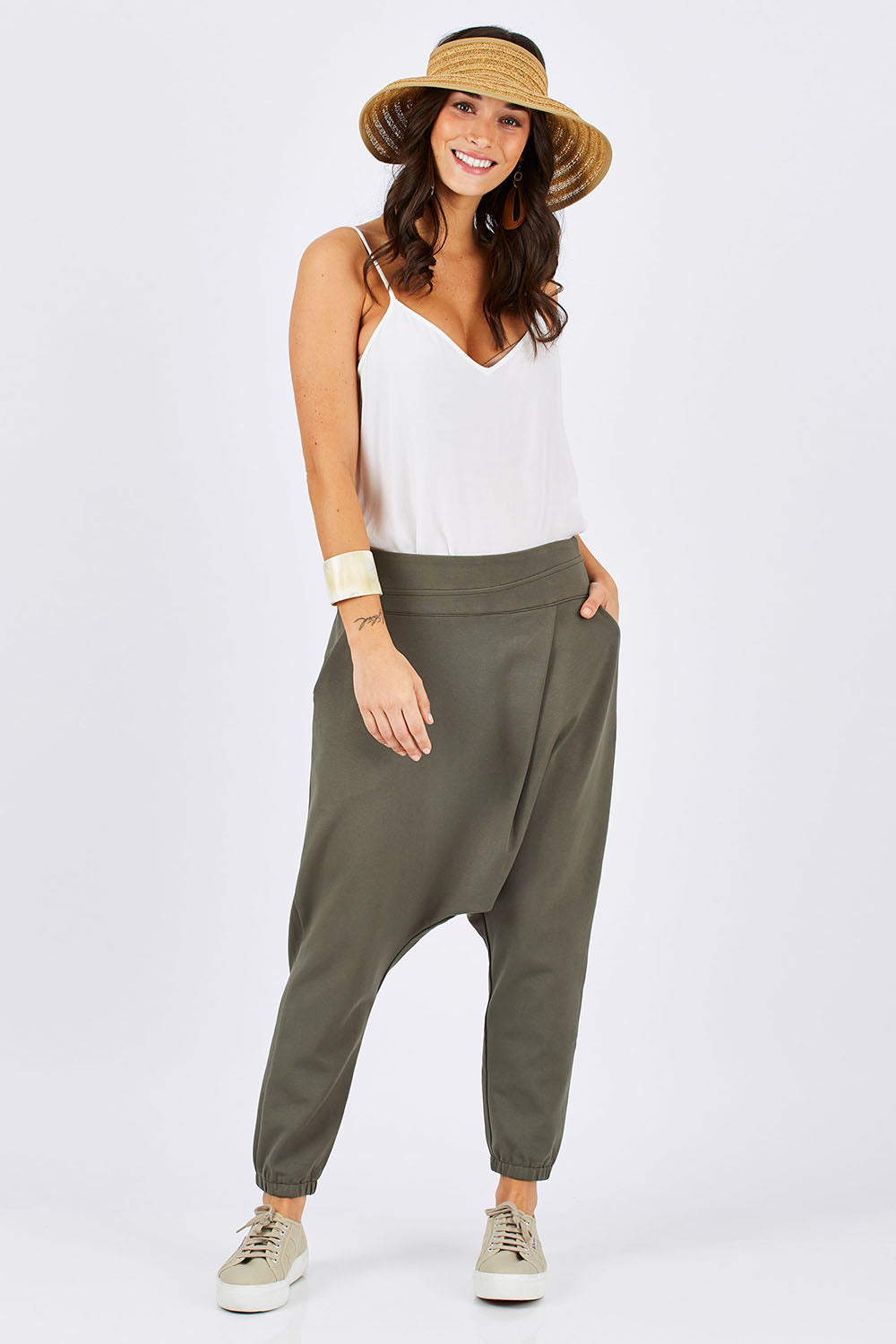Model Georgia wearing size 10 of the Relax With Me Pants in colour Moss (Green), from the front, showing the whole outfit