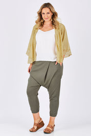 Model Jess wearing size 14 of the Relax With Me Pants in colour Moss (Green), from the front, showing the whole outfit