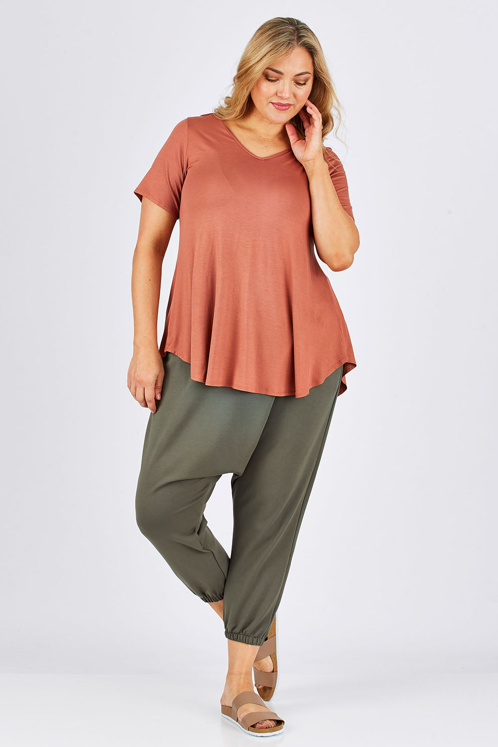 Model Ljubenka wearing size 18 of the Relax With Me Pants in colour Moss (Green), from the front, showing the whole outfit