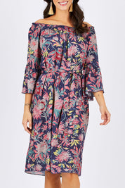Model Georgia wearing size 10 of the Ti Amo Dress in colour BluePink (Blue), from the front, cropped image
