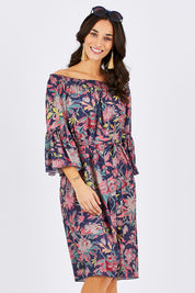 Model Georgia wearing size 10 of the Ti Amo Dress in colour BluePink (Blue), from the front, cropped image