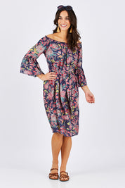 Model Georgia wearing size 10 of the Ti Amo Dress in colour BluePink (Blue), from the front, showing the whole outfit