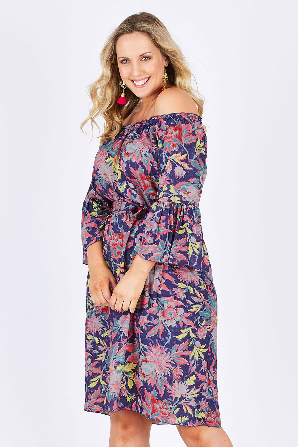 Model Jess wearing size 14 of the Ti Amo Dress in colour BluePink (Blue), from the front, cropped image