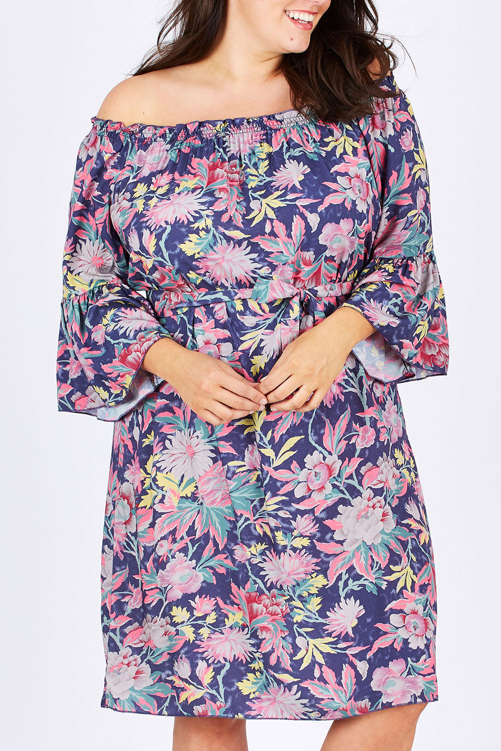 Model Mae wearing size 18 of the Ti Amo Dress in colour BluePink (Blue), from the front, cropped image