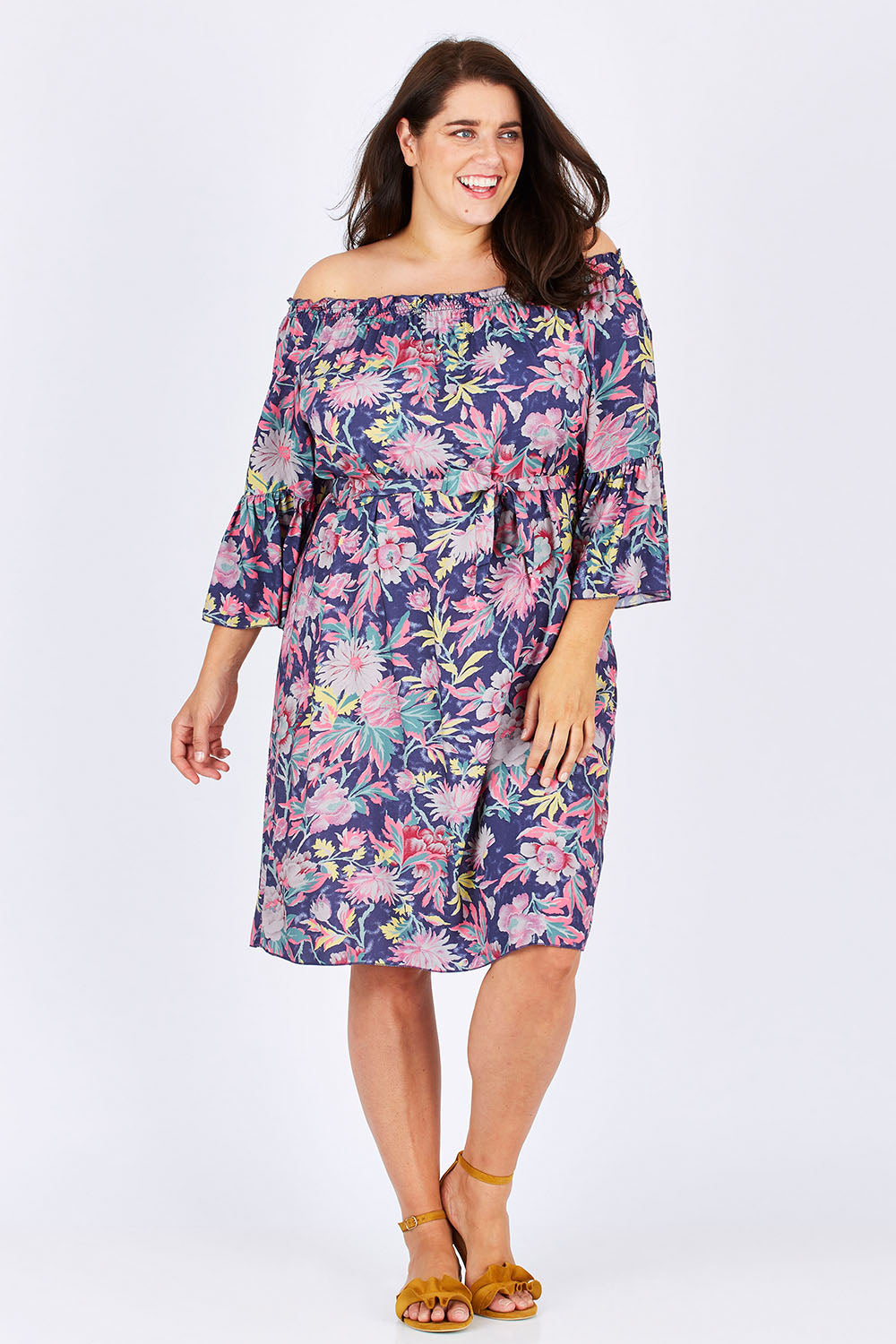 Model Mae wearing size 18 of the Ti Amo Dress in colour BluePink (Blue), from the front, showing the whole outfit