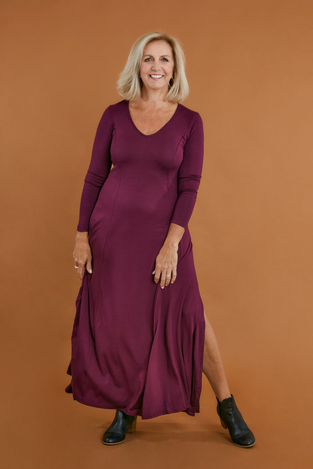 Model Sandy wearing size 10 of the My Faithful Maxi Tee Dress in colour Scarlet (Red), from the front, showing the whole outfit