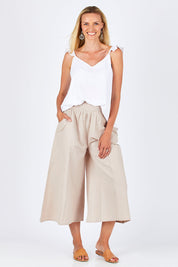 Model Anna wearing size 10 of the Easy Daze Wide Cotton Linen Pants in colour Sand, from the front, showing the whole outfit