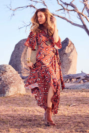 Model Marnee wearing size 10 of the Maximum Impact Dress in colour Rust, from the front, showing the whole outfit