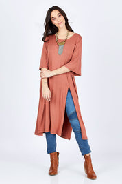 Model Georgia wearing size 10 of the Softly Falling Bamboo Tunic in colour Copper, from the front, showing the whole outfit